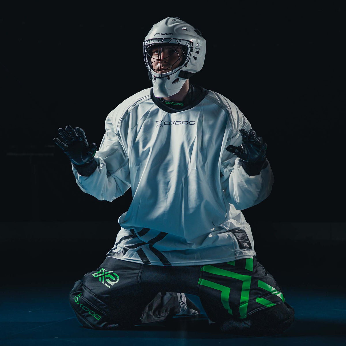 Goalkeeper kneeling in the white Oxdog X2 Plus jersey