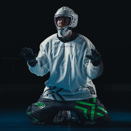 Goalkeeper kneeling in the white Oxdog X2 Plus jersey