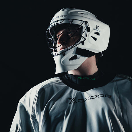 Goalkeeper in a white Oxdog mask and X2 Plus jersey in close-up