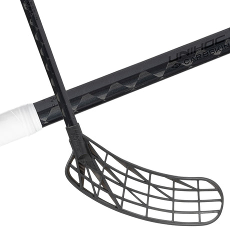 Unihoc Carbskin 26 Slim Oval Black Edition floorball stick, black shaft and blade