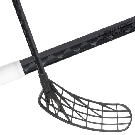 Unihoc Carbskin 26 Slim Round Black Edition floorball stick, all black carbon shaft and dark grey blade